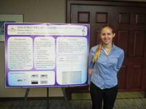 Natalie Wilkinson by her poster
